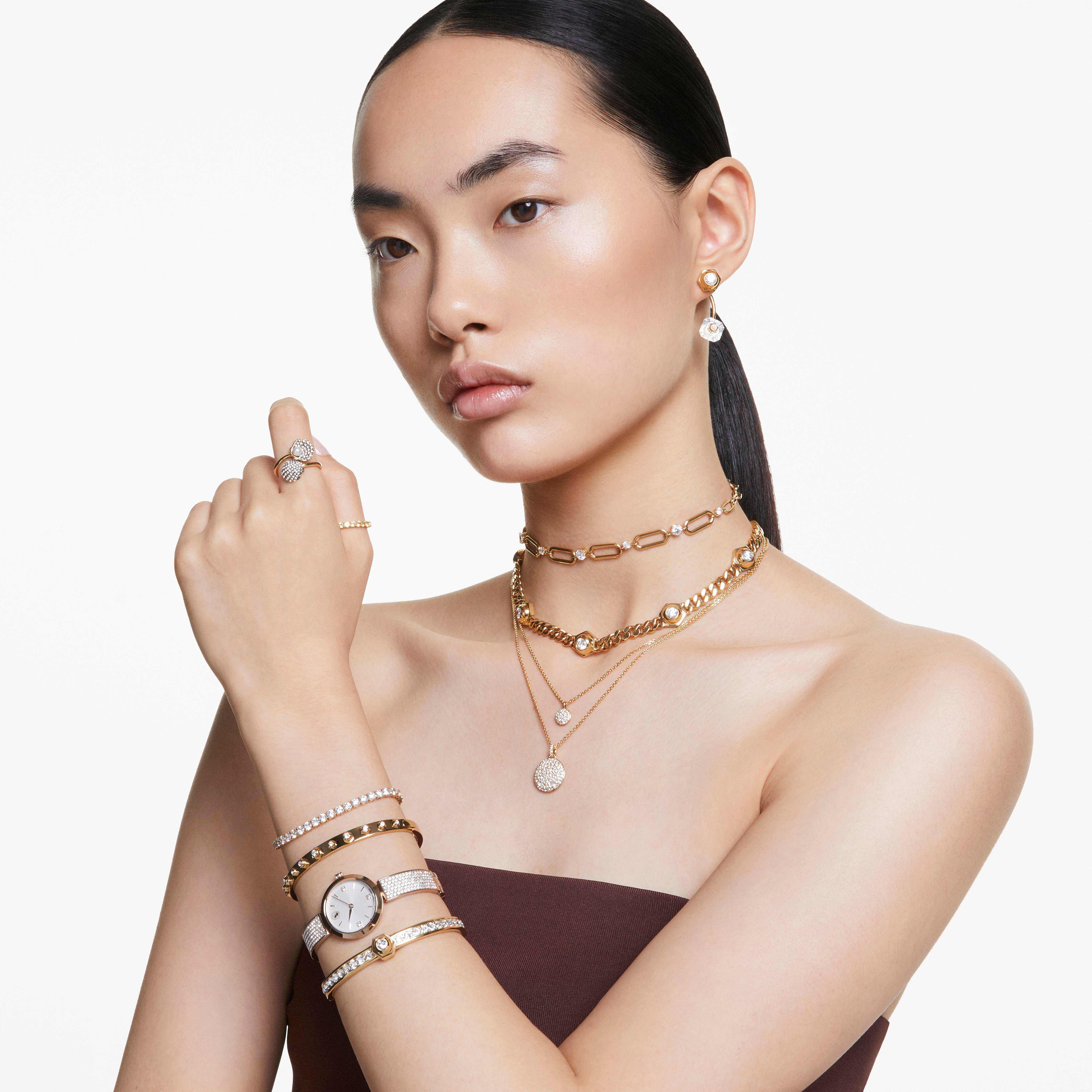 swarovski illumina watch  swiss made  metal bracelet  gold tone  champagne gold tone finish