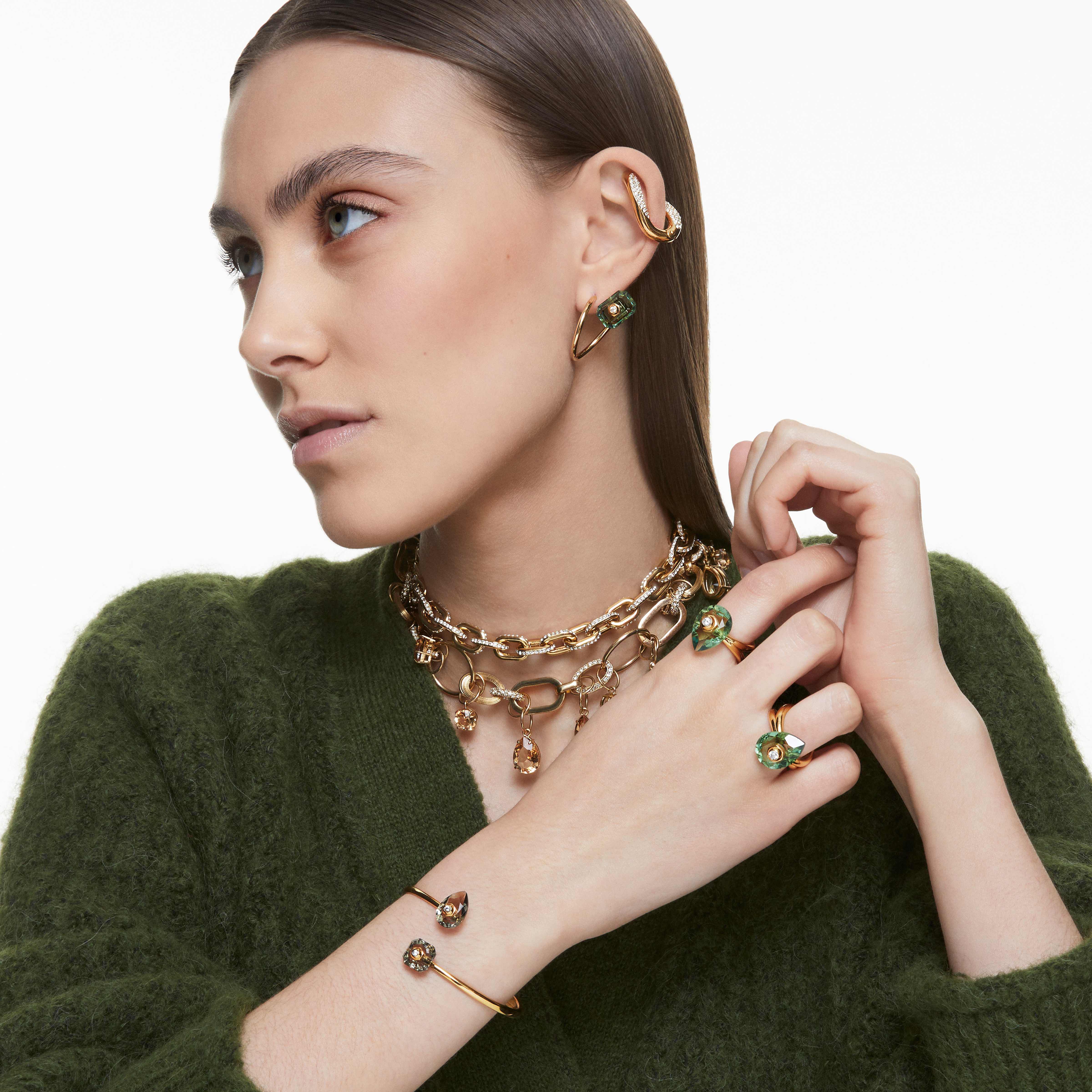 swarovski numina ring  pear cut crystal  green  gold tone plated